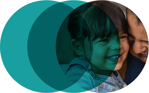 child and adult smiling